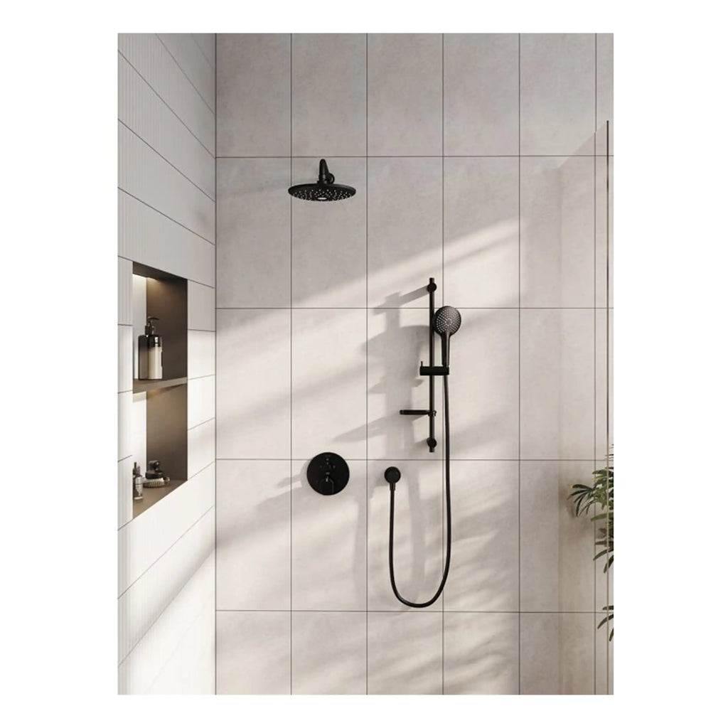 Modern black rainfall and handheld shower system in minimalist bathroom with large beige wall tiles and built-in niche for bath products.