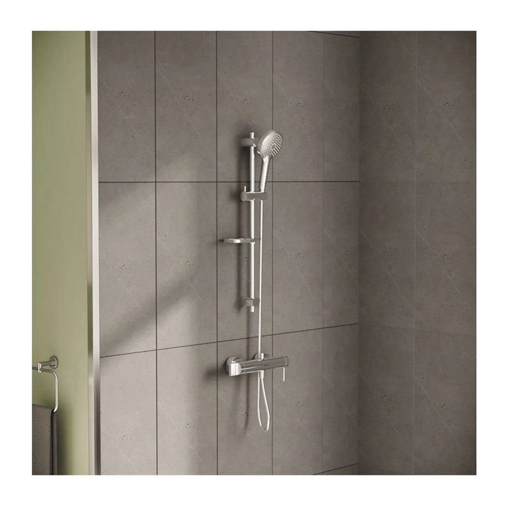 Modern shower system with adjustable handheld showerhead and sliding bar on grey tiled bathroom wall.