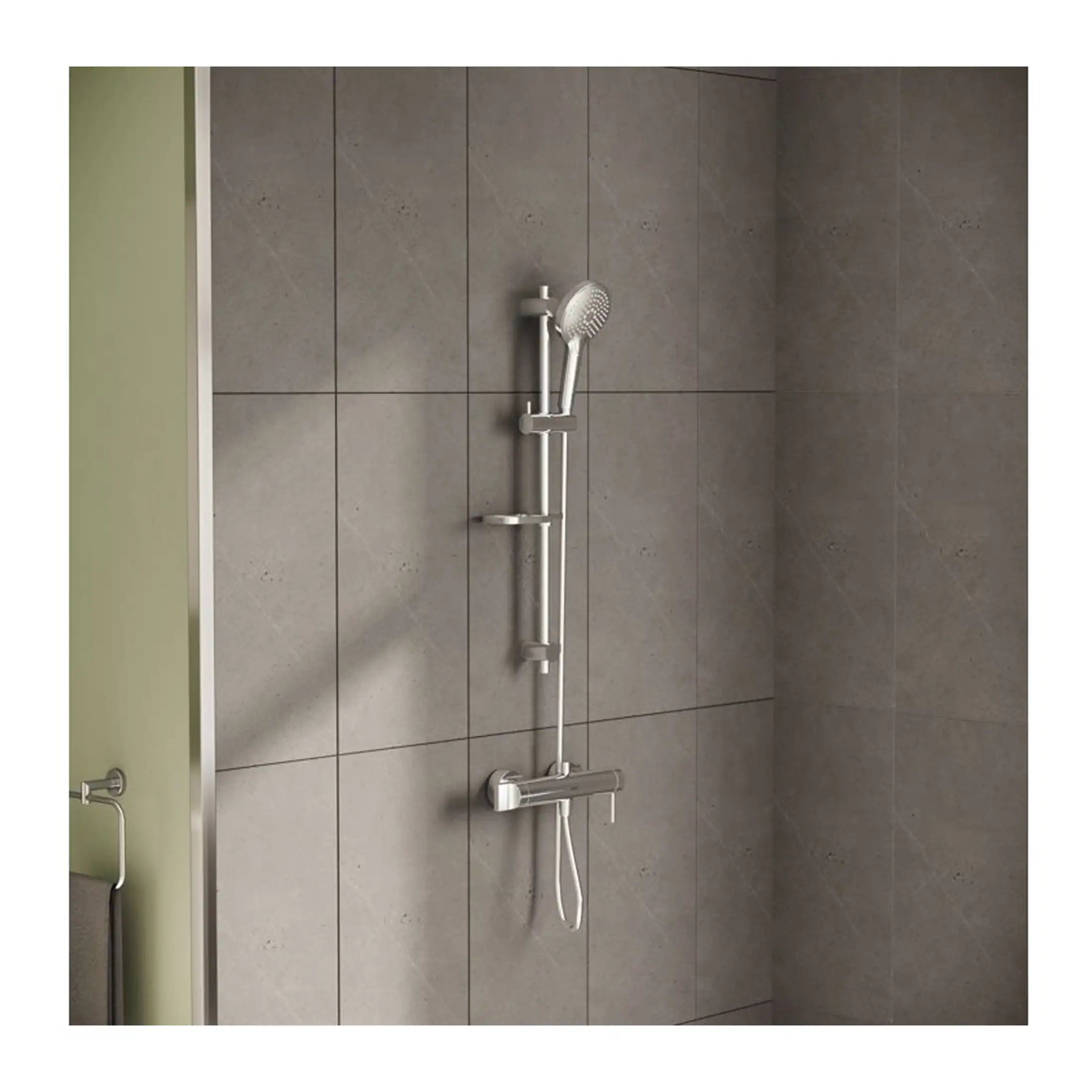 Modern shower system with adjustable handheld showerhead and sliding bar on grey tiled bathroom wall.