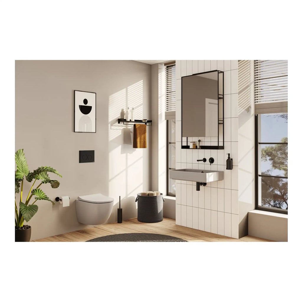 Sleek modern bathroom with white tiled walls, black fixtures, and natural light, featuring a wall-mounted toilet, minimalist sink, and stylish black-framed mirror, perfect for contemporary design.