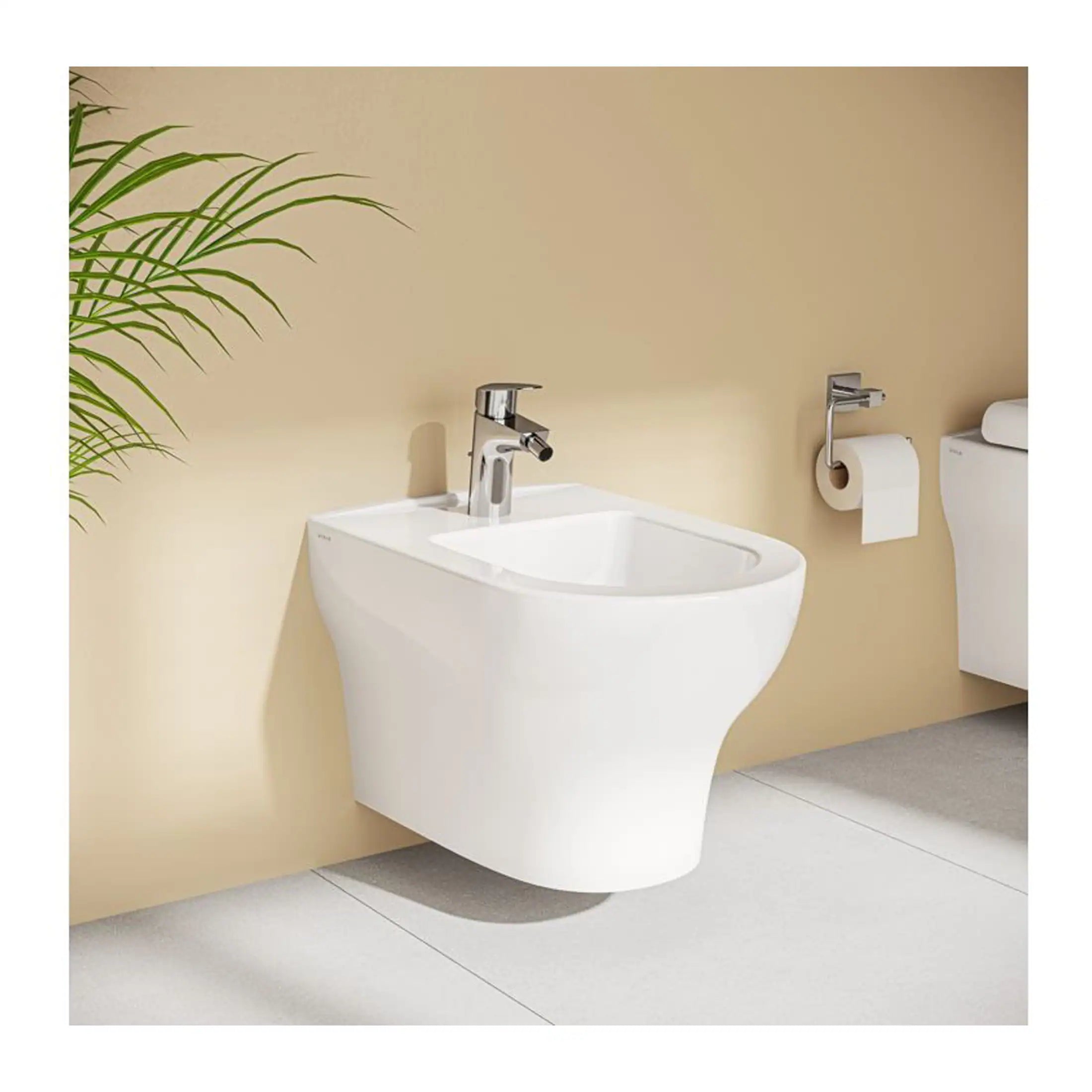 A sleek, modern wall-mounted white bathroom sink with chrome faucet, positioned next to a toilet with a toilet paper holder, in a minimalist bathroom setting with a beige wall and grey floor.