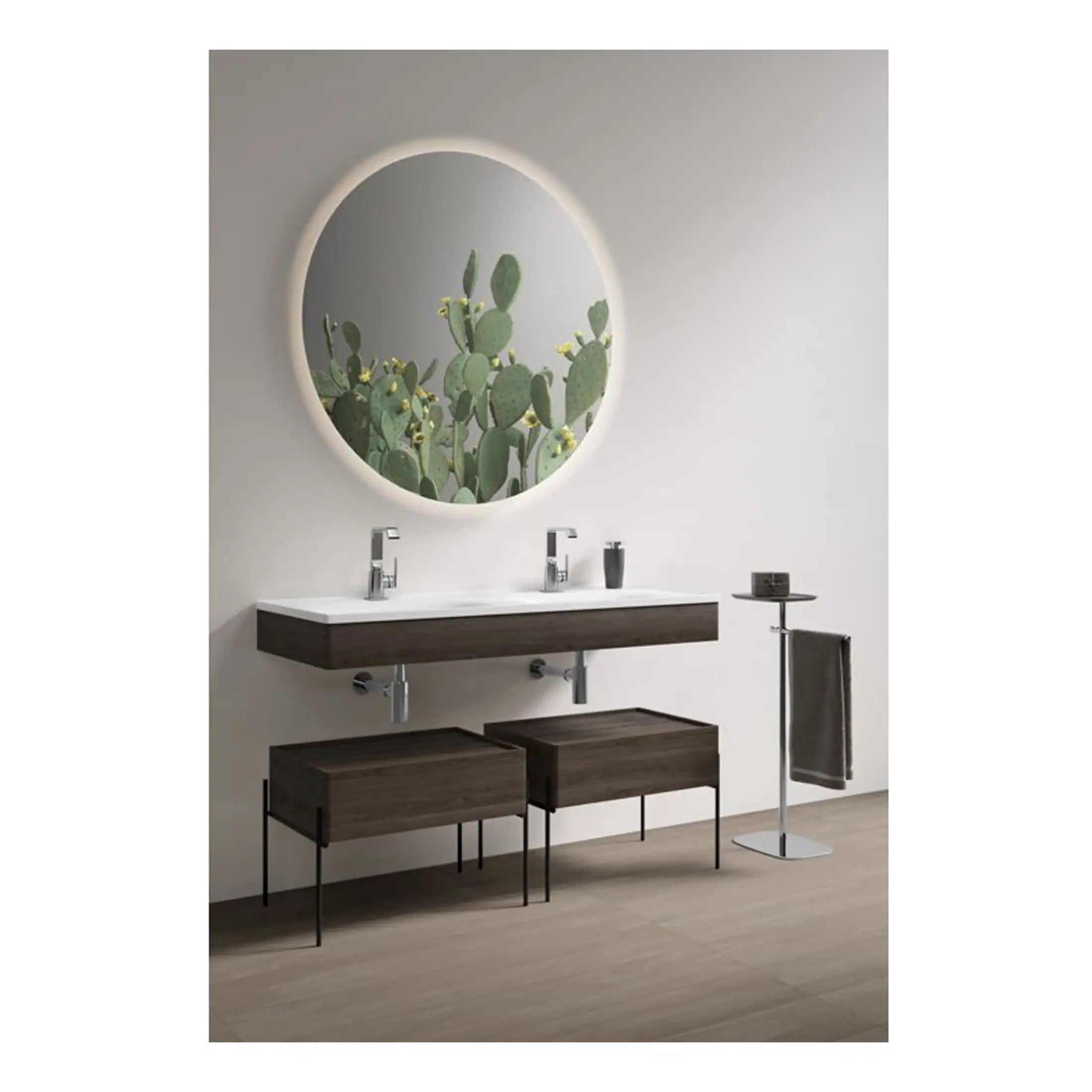 Smooth modern bathroom vanity with dual sinks, wooden cabinetry, and large round mirror reflecting a cactus picture, creating a sleek, contemporary space.