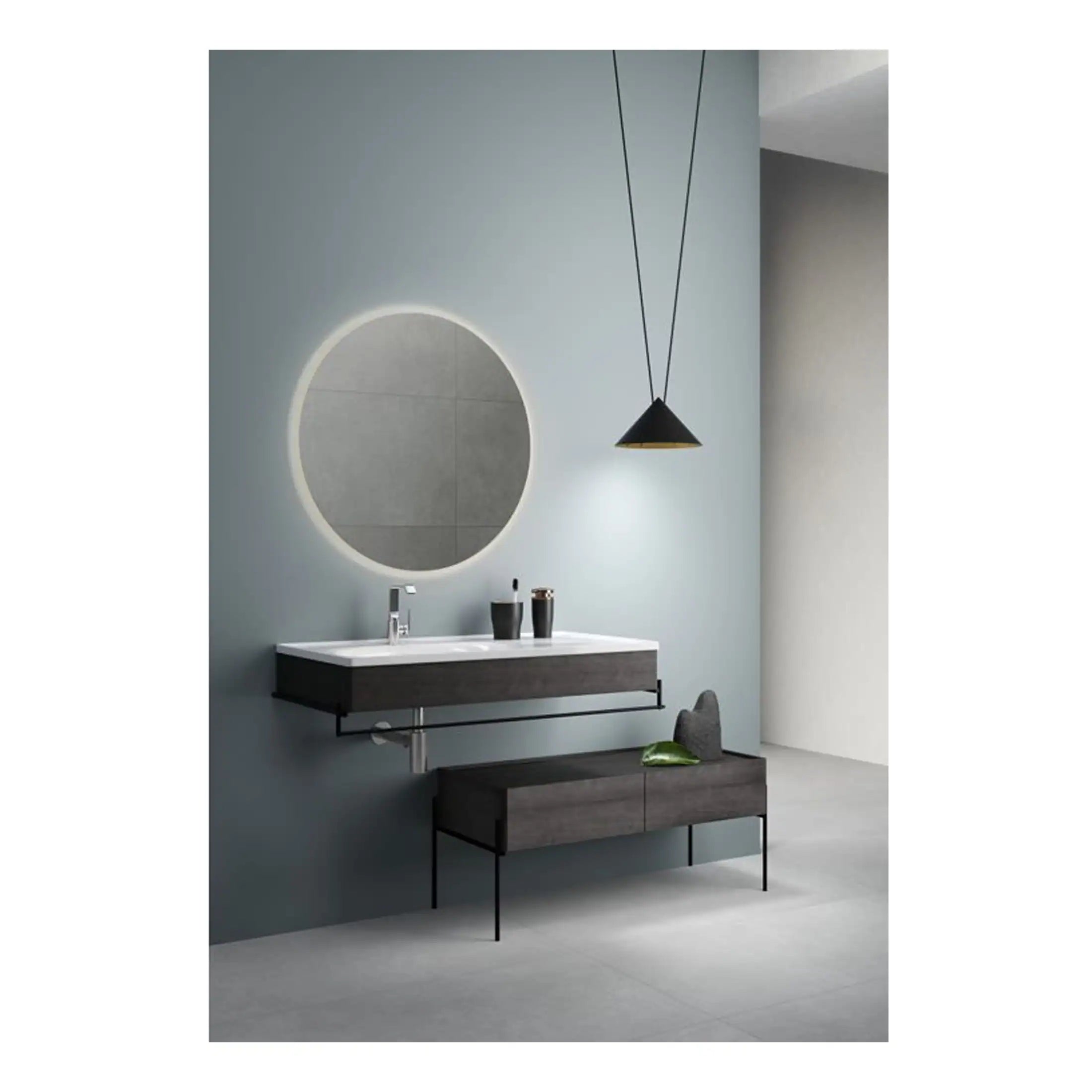 High-end modern bathroom featuring a sleek wall-mounted vanity unit, round illuminated mirror, minimalist basin with black accessories, and contemporary pendant lighting in a sophisticated colour scheme.