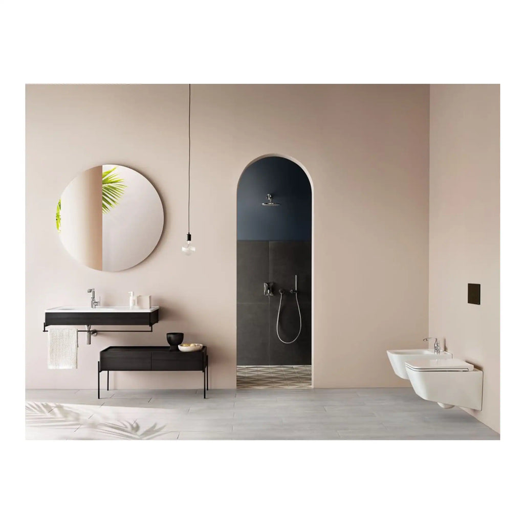 Modern minimalist bathroom with black vanity, round mirror, and walk-in shower featuring sleek fixtures and neutral tones for contemporary style.