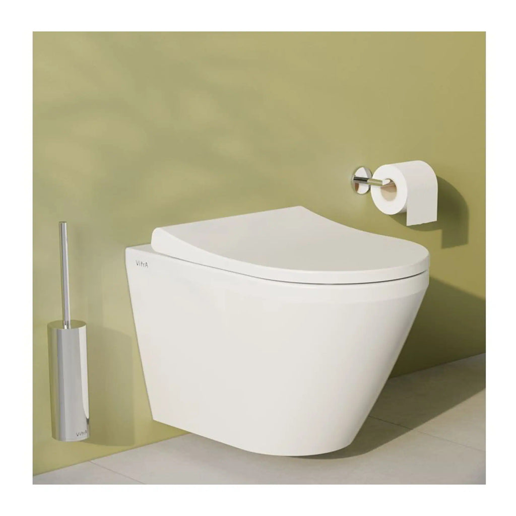 Sleek modern toilet with a minimalist design, accompanied by a toilet brush and toilet paper holder, ideal for contemporary bathrooms, promoting cleanliness and style.