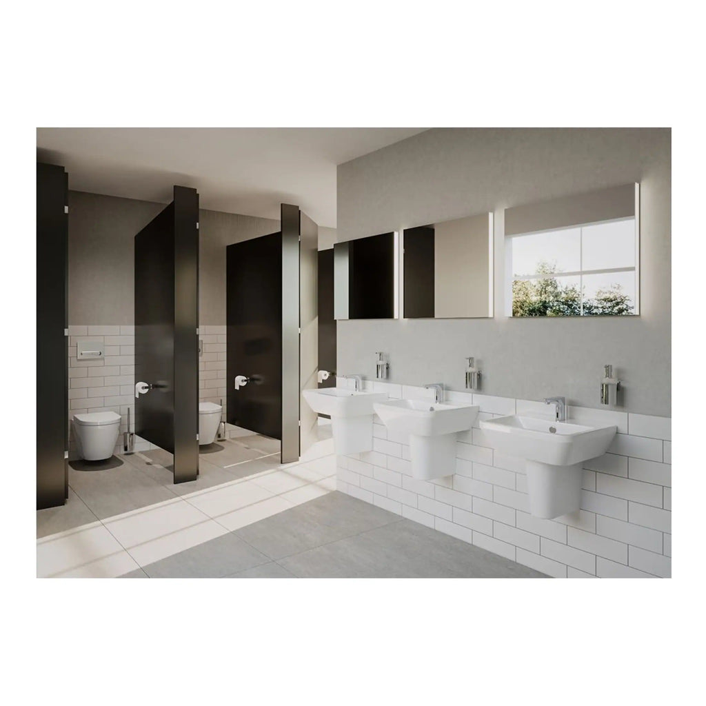 Modern public bathroom with white sinks, black privacy cubicles, and natural light through large windows, ideal for commercial or institutional restrooms with sleek design and functionality.