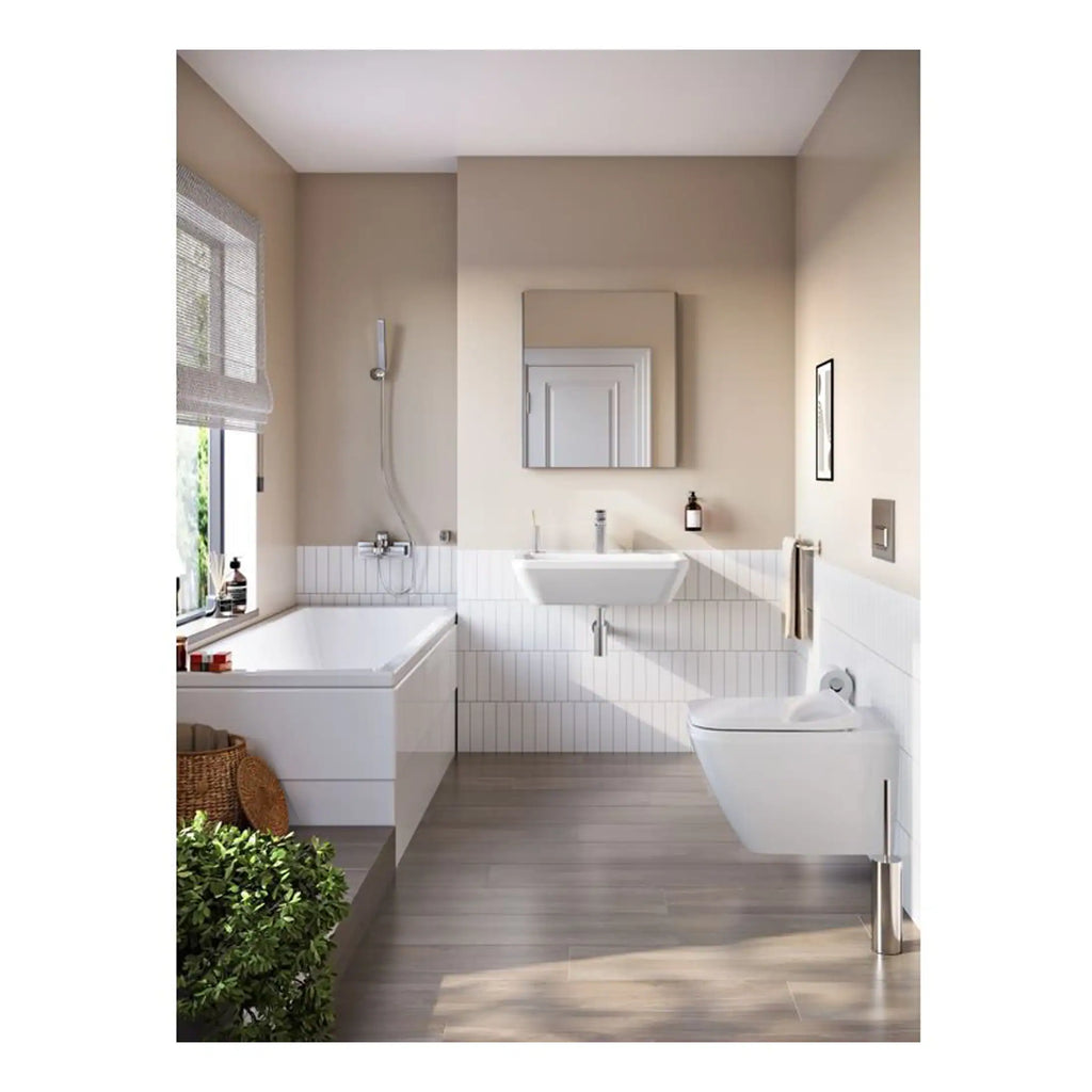 Modern minimalist bathroom with free-standing bath, wall-mounted toilet, basin with mirror, neutral tones, natural light, suitable for contemporary bathroom renovation.