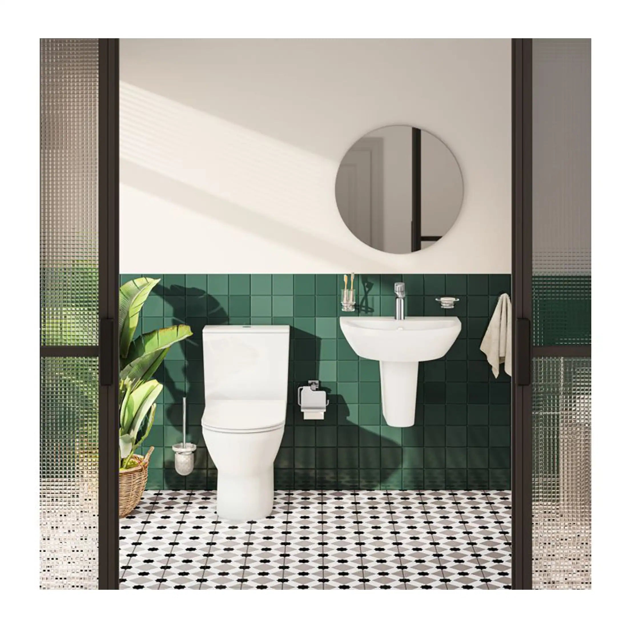 Modern bathroom with green tiled walls, white toilet and wall-mounted sink, decorative mirror, and stylish black-framed glass doors, creating a contemporary and functional space.