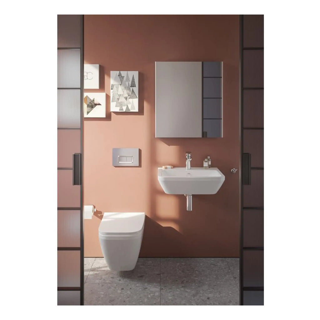 Sleek modern bathroom with wall-mounted toilet, minimalist sink, and contemporary decor featuring soft pink walls and elegant storage cabinets, perfect for stylish bathroom renovation.
