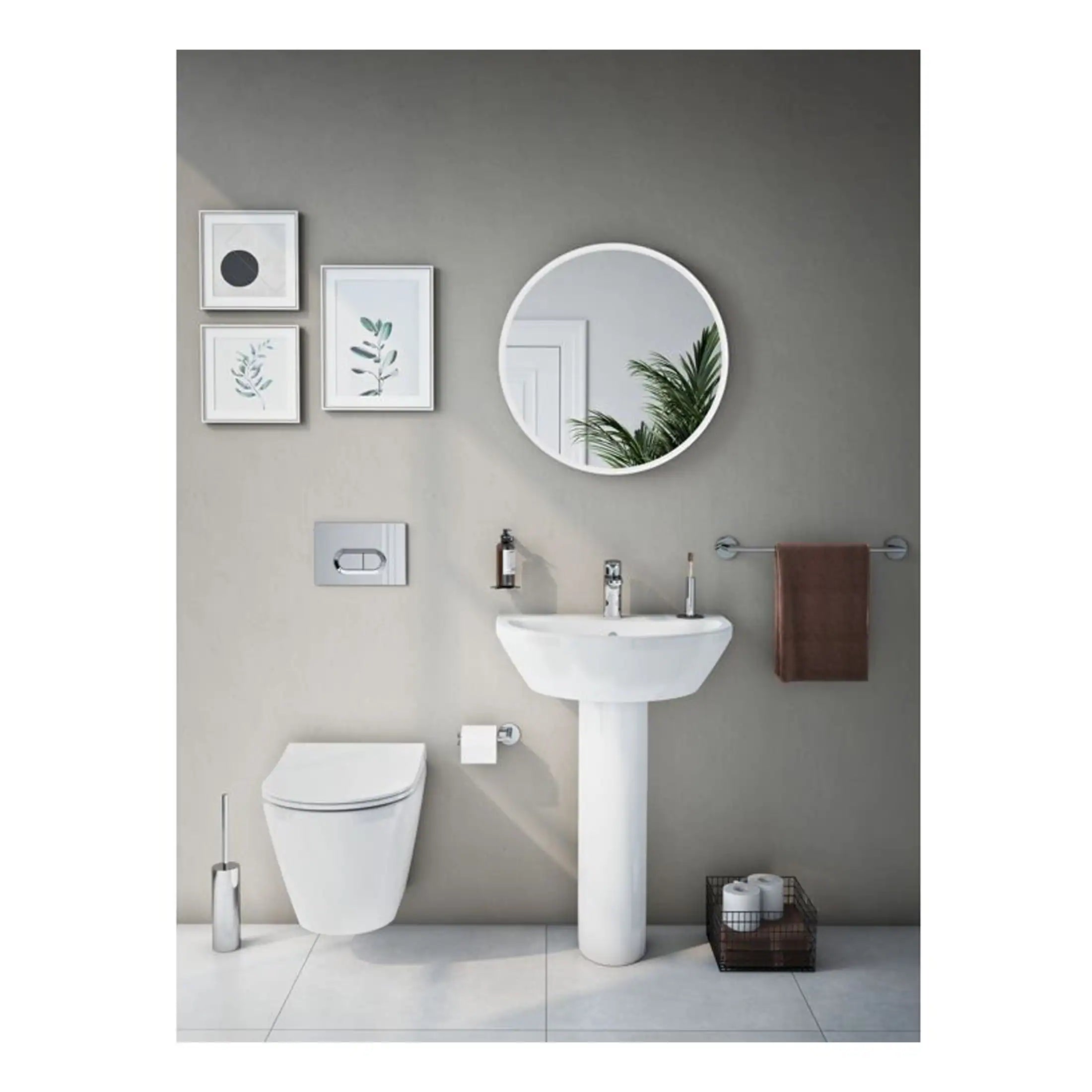 Sleek modern bathroom with wall-mounted toilet, pedestal sink, round mirror, and minimalist decor including framed botanical artwork and brown towel. Perfect for stylish bathroom renovations.