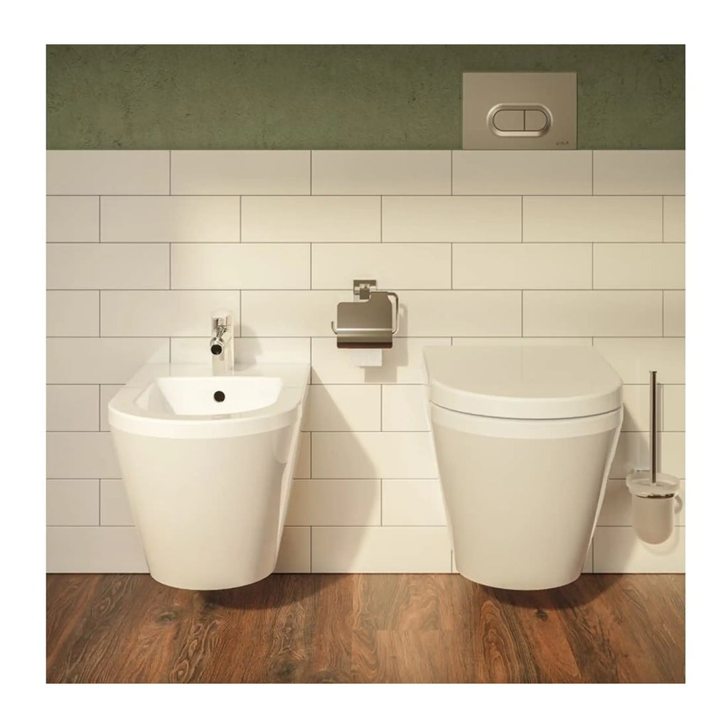 Sleek white bidet and toilet with modern design in a stylish bathroom setting.