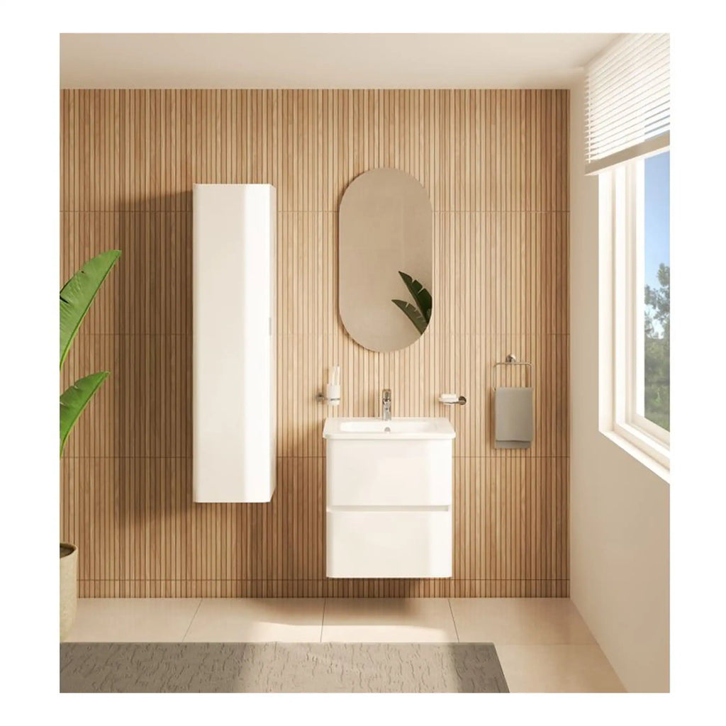 Sleek modern bathroom with wall-mounted sink, oval mirror, wooden slat wall, and large window enhancing natural light. Perfect for contemporary bathroom design.