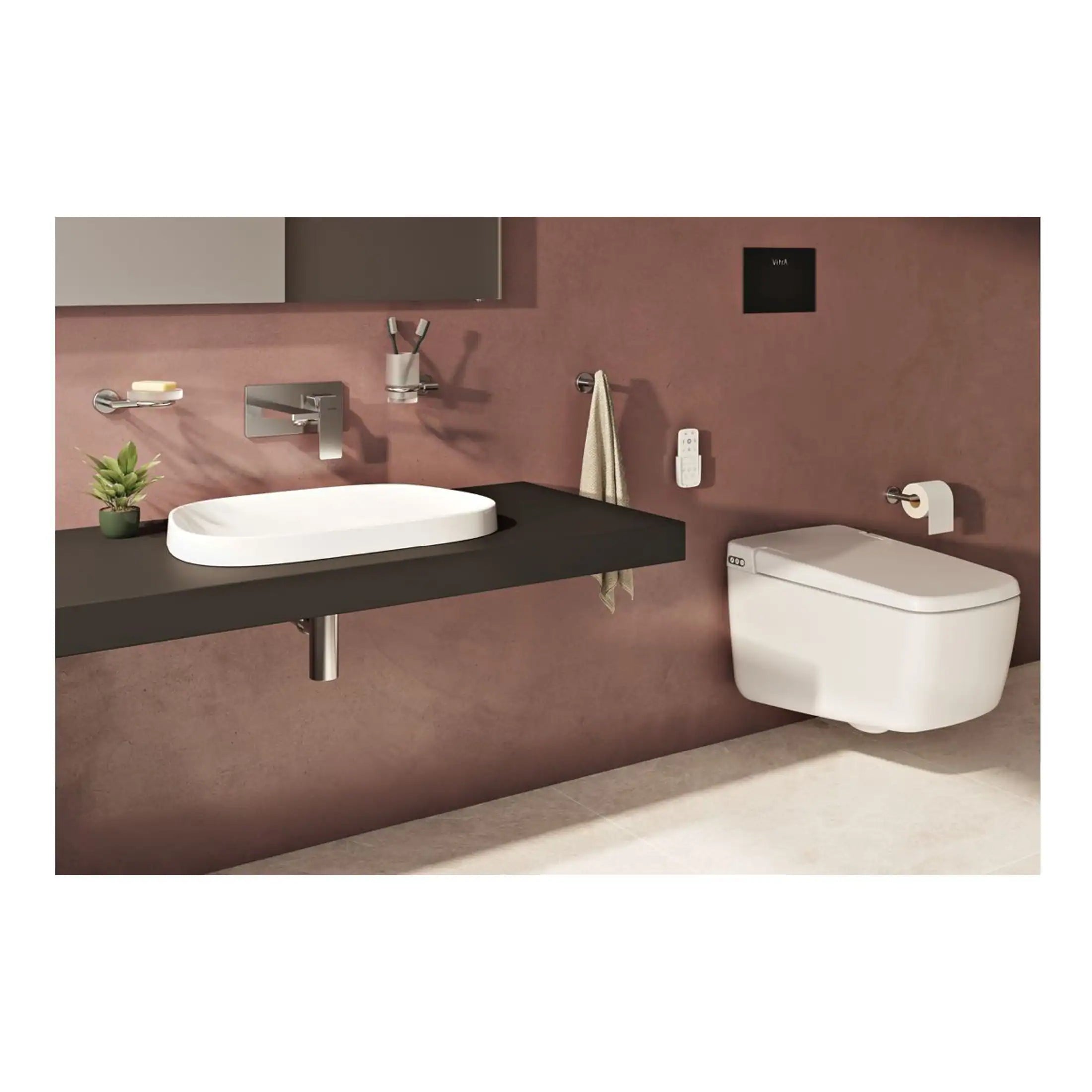 Sleek modern bathroom with wall-mounted toilet, minimalist sink, and contemporary fixtures, featuring a warm pink wall and stylish accessories for a luxurious bath design.