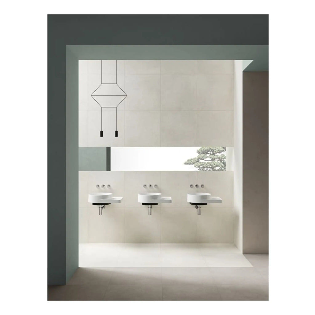 Sleek modern bathroom with three wall-mounted white sinks and a minimalist black pendant light, featuring neutral tones and a large window with a view of a Japanese bonsai tree, perfect for contemporary bathroom design.