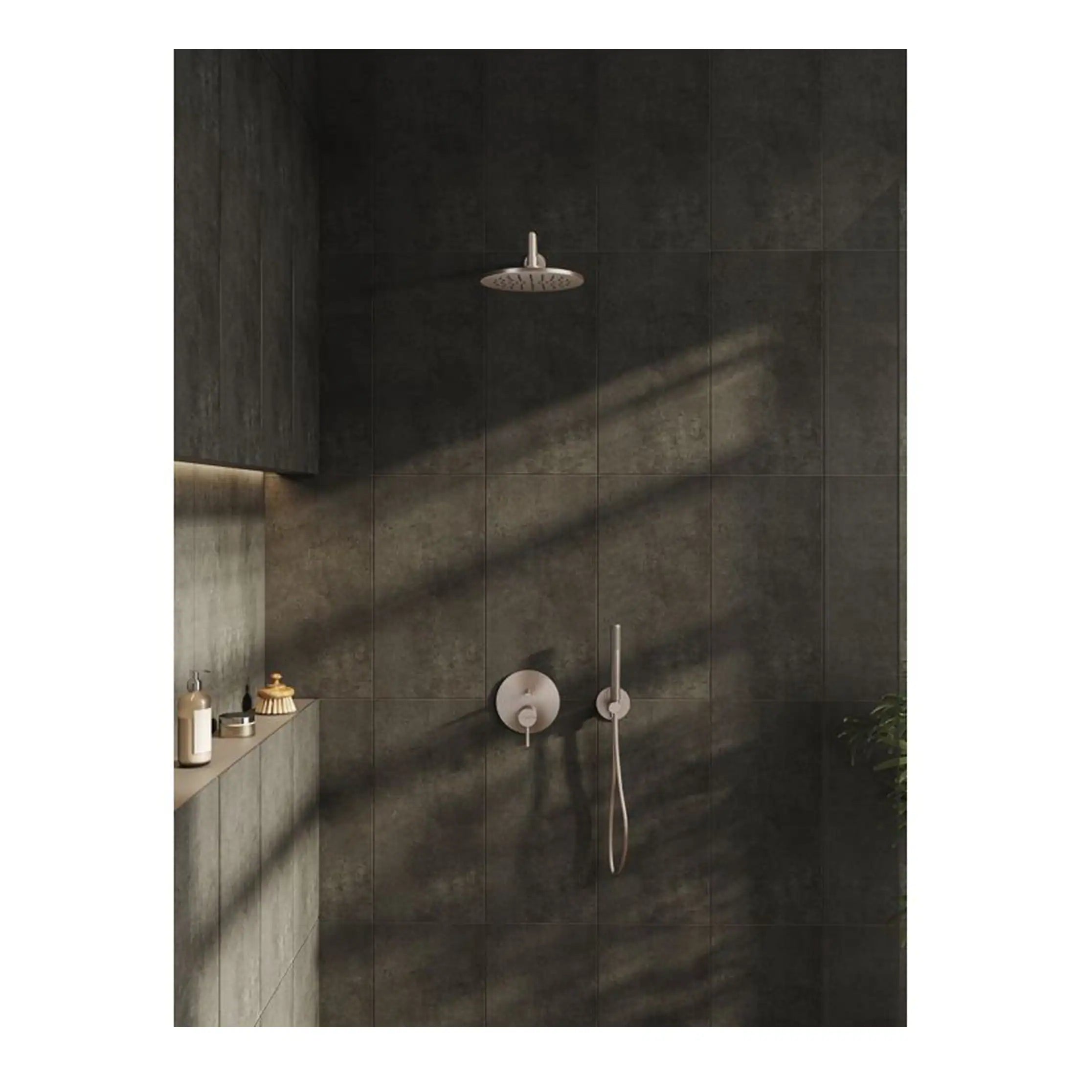 Sleek modern shower system with rain shower head and handheld attachment in a contemporary dark tiled bathroom, showcasing minimalist bathroom design by Bubly Bathrooms.