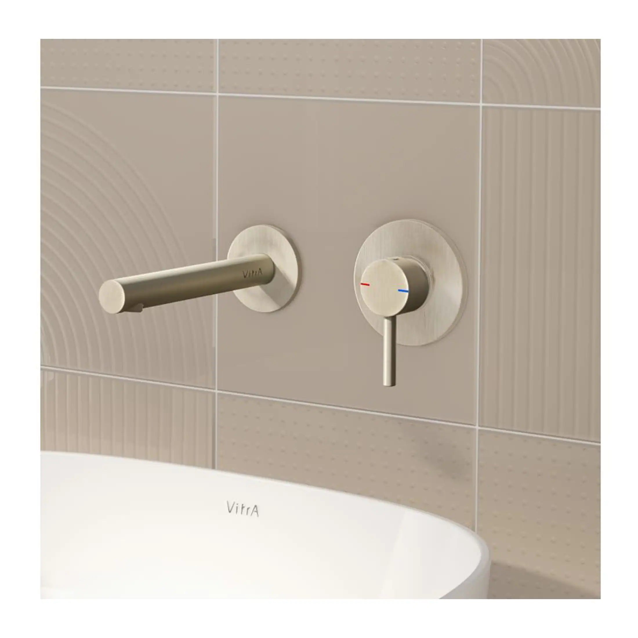 Brushed stainless steel bathroom faucet and temperature control valve on beige tiled wall, modern bathroom fixtures.