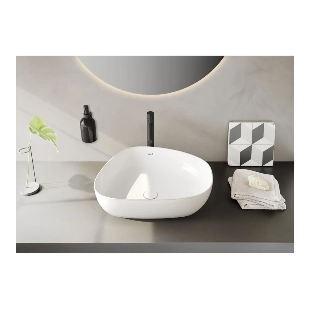 Minimalist modern bathroom sink with sleek black faucet, contemporary decor, and neutral tones, perfect for stylish bathroom designs. Elegant and functional for sophisticated bathroom spaces.