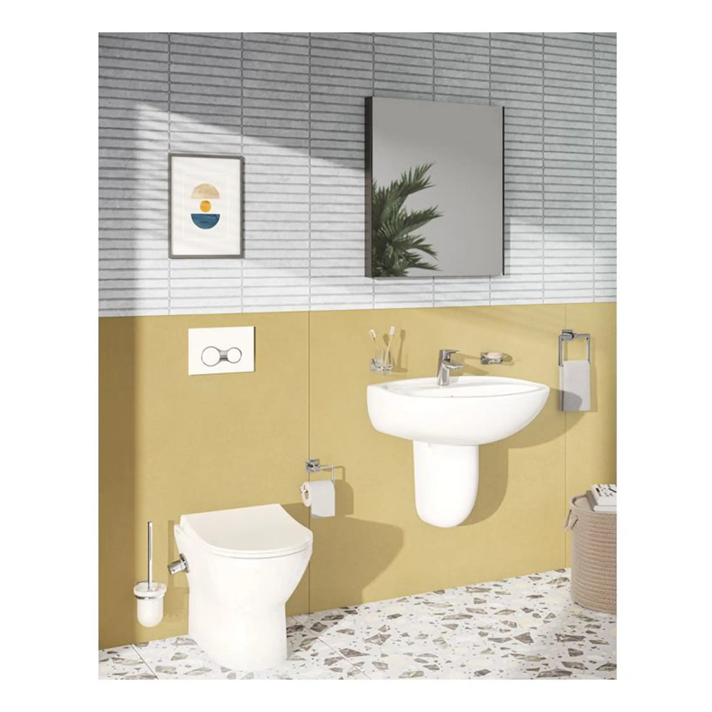 Sleek modern bathroom interior featuring a wall-mounted toilet, a stylish white sink, a large mirror, and contemporary accessories in a bright, minimalist design.