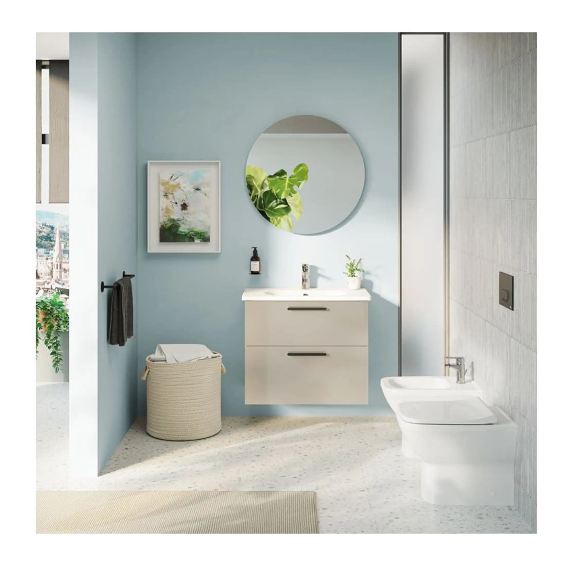 Sleek modern bathroom with light blue walls, wall-mounted vanity, round mirror, and contemporary fixtures, showcasing stylish bathroom design and decor.