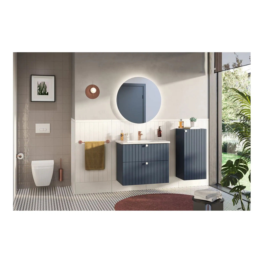 Sleek modern bathroom with navy blue cabinetry, round illuminated mirror, and stylish accessories, showcasing contemporary bathroom design and vanity units from Bubly Bathrooms.