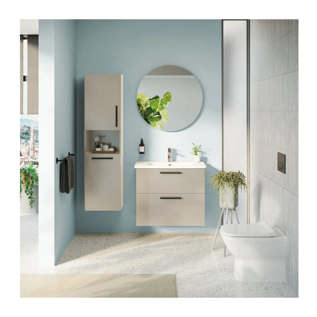 Contemporary bathroom with minimalist white vanity, circular mirror, wall-mounted cabinet, indoor plant, and modern toilet in a bright, airy setting with soft blue and neutral tones.