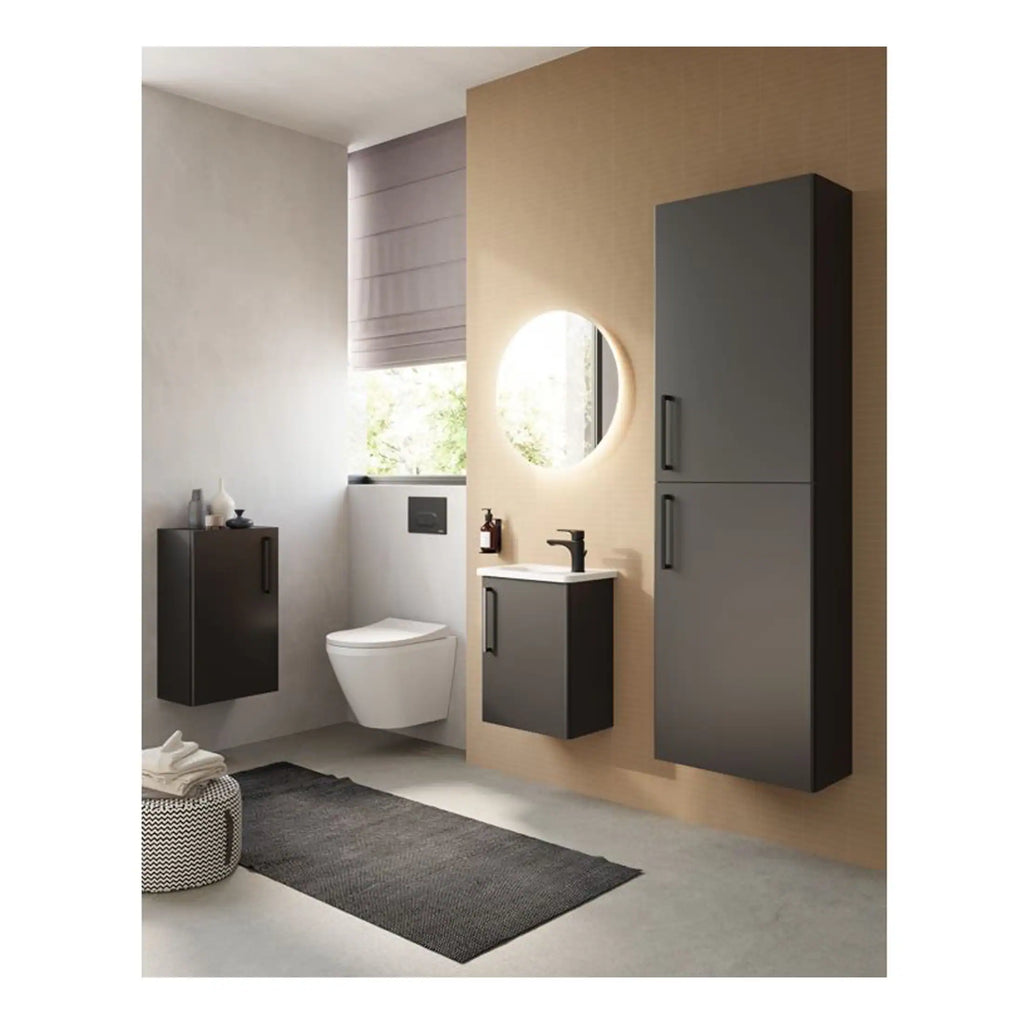 Contemporary bathroom with dark grey wall-mounted cabinets, a sleek black faucet, round mirror with LED lighting, modern toilet, and minimalist decor in neutral tones.