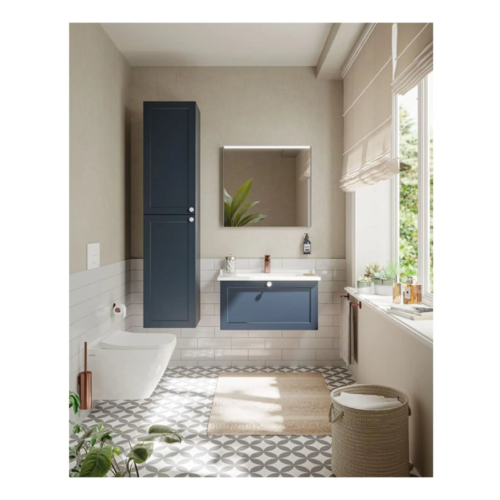 Bright modern bathroom with navy blue storage cabinets, a sleek vanity, and decorative floor tiles, featuring natural light from large windows, creating a stylish and functional space for relaxation.