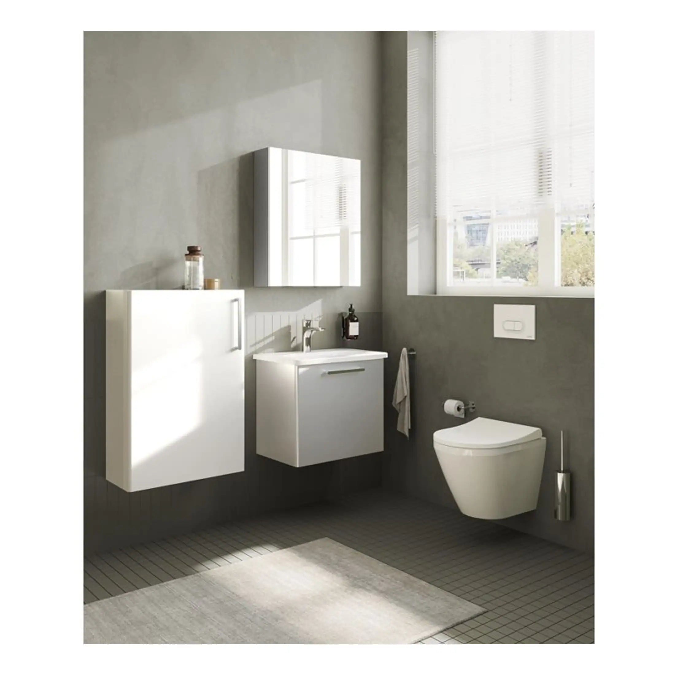 Sleek modern white bathroom vanity with integrated sink, wall-mounted toilet and minimalist cabinetry, featuring natural light and neutral tones for a contemporary bathroom design.