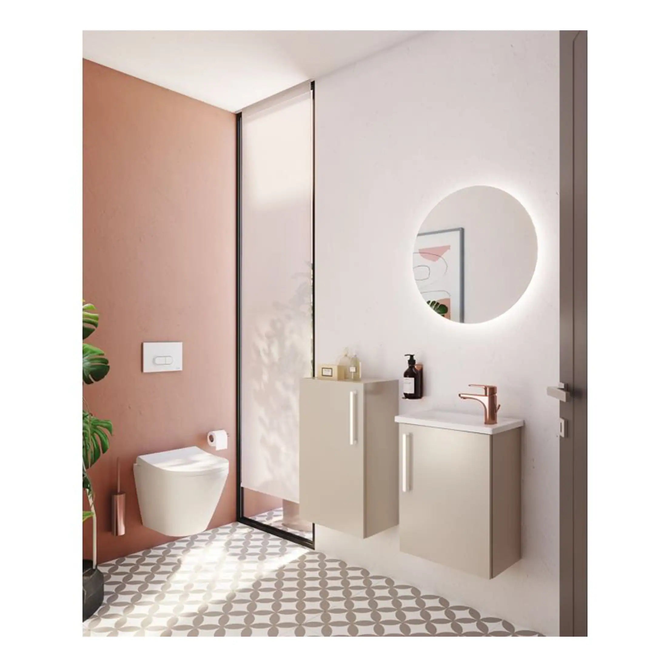 Sleek modern bathroom with floating vanity units, illuminated round mirror, and stylish pink and white colour scheme. Features contemporary fixtures ideal for small bathroom spaces.