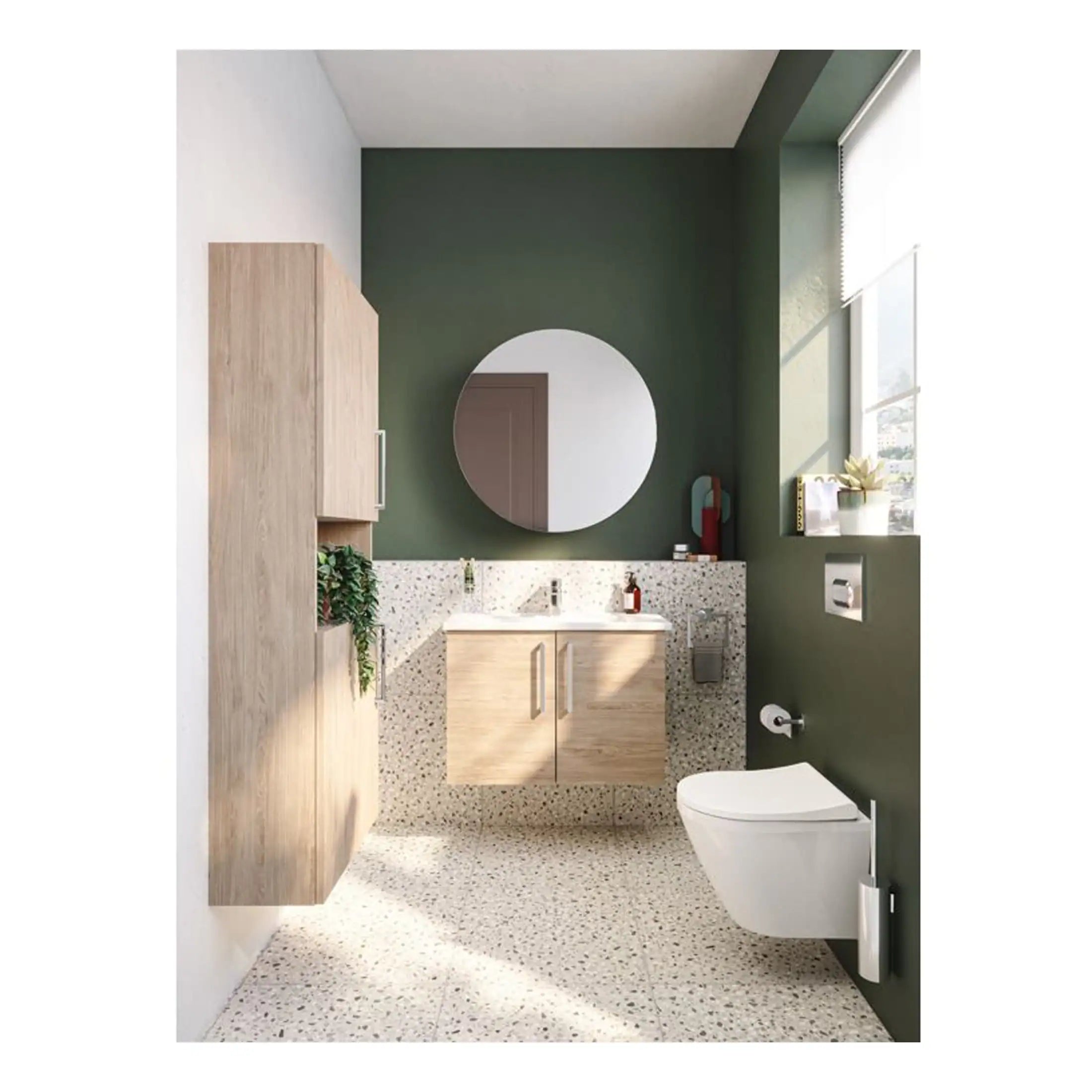 Contemporary bathroom with green accent wall, modern floating toilet, terrazzo flooring, and wooden vanity cabinet, featuring a large round mirror and natural light.