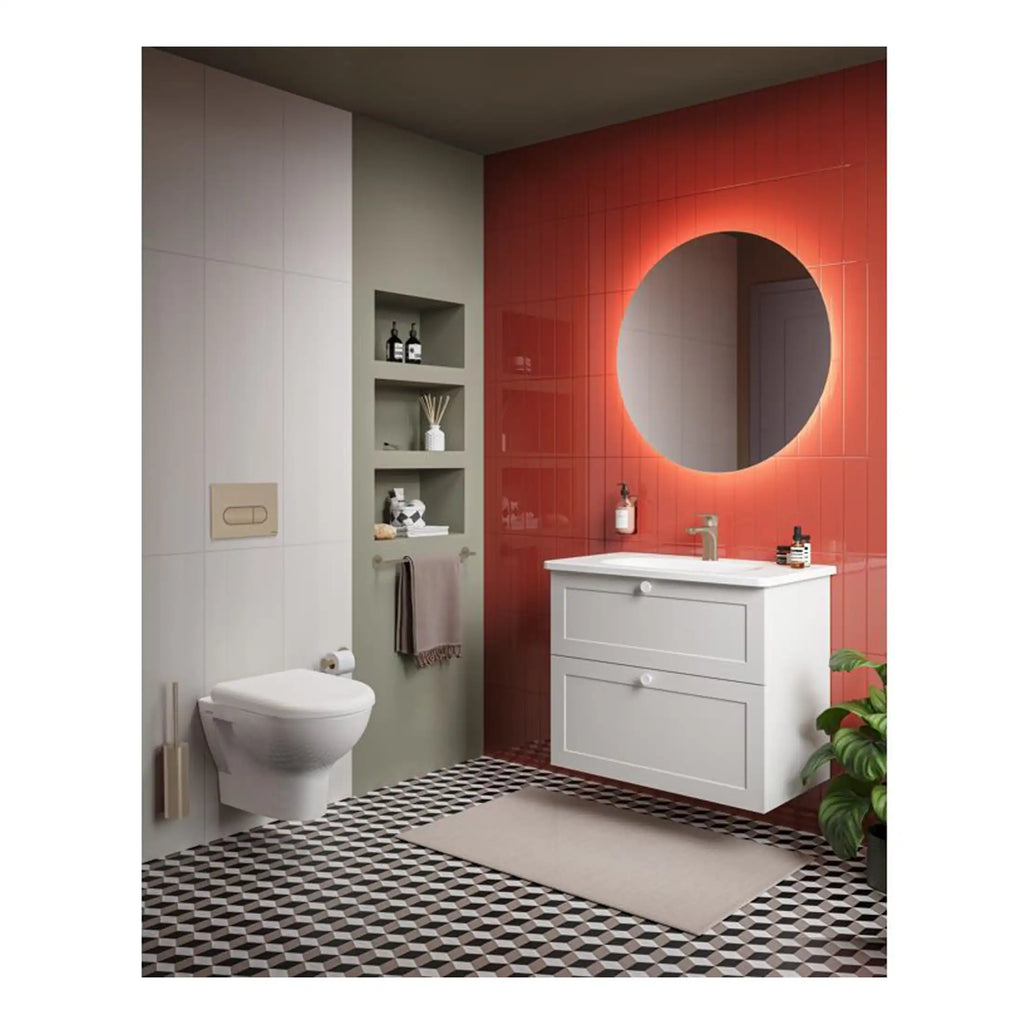 Elegant contemporary bathroom with a sleek white vanity and round lit mirror, featuring geometric patterned floor tiles and built-in shelving, perfect for modern bathroom design.