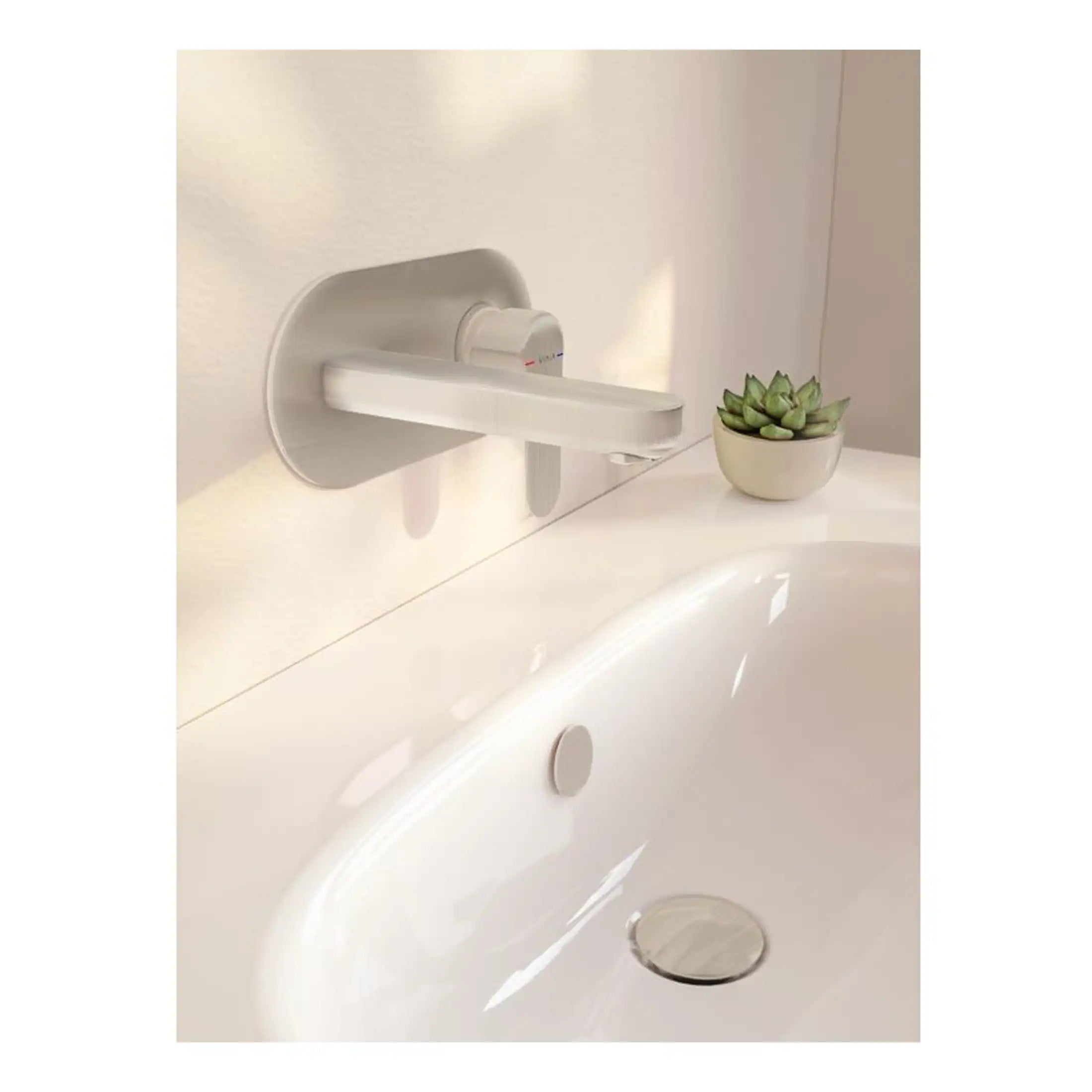 Sleek white bathroom tap mounted on wall above bathtub, modern bathroom fixture with minimalist design and clean aesthetic.