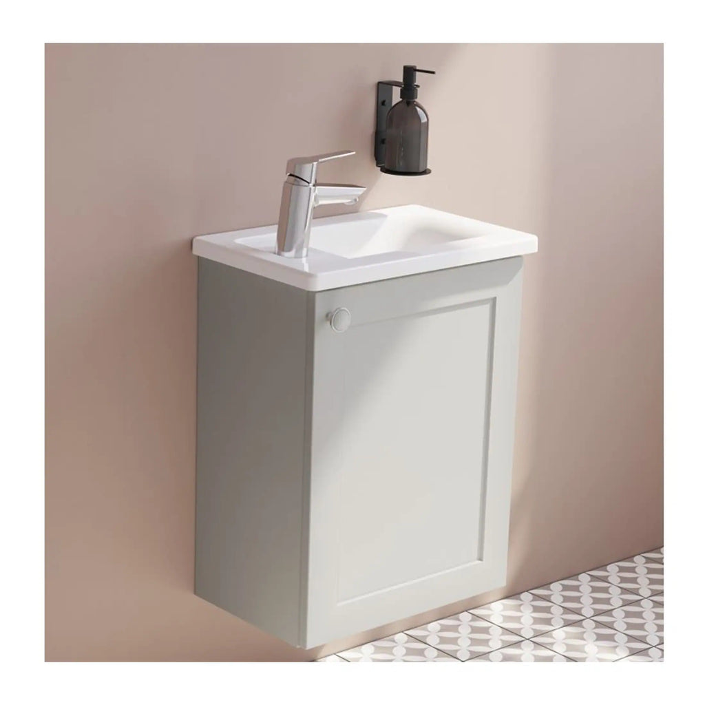 Contemporary bathroom vanity with white ceramic sink, modern chrome tap, wall-mounted soap dispenser, and minimalist cabinet design, ideal for small bathroom renovation or decoration.