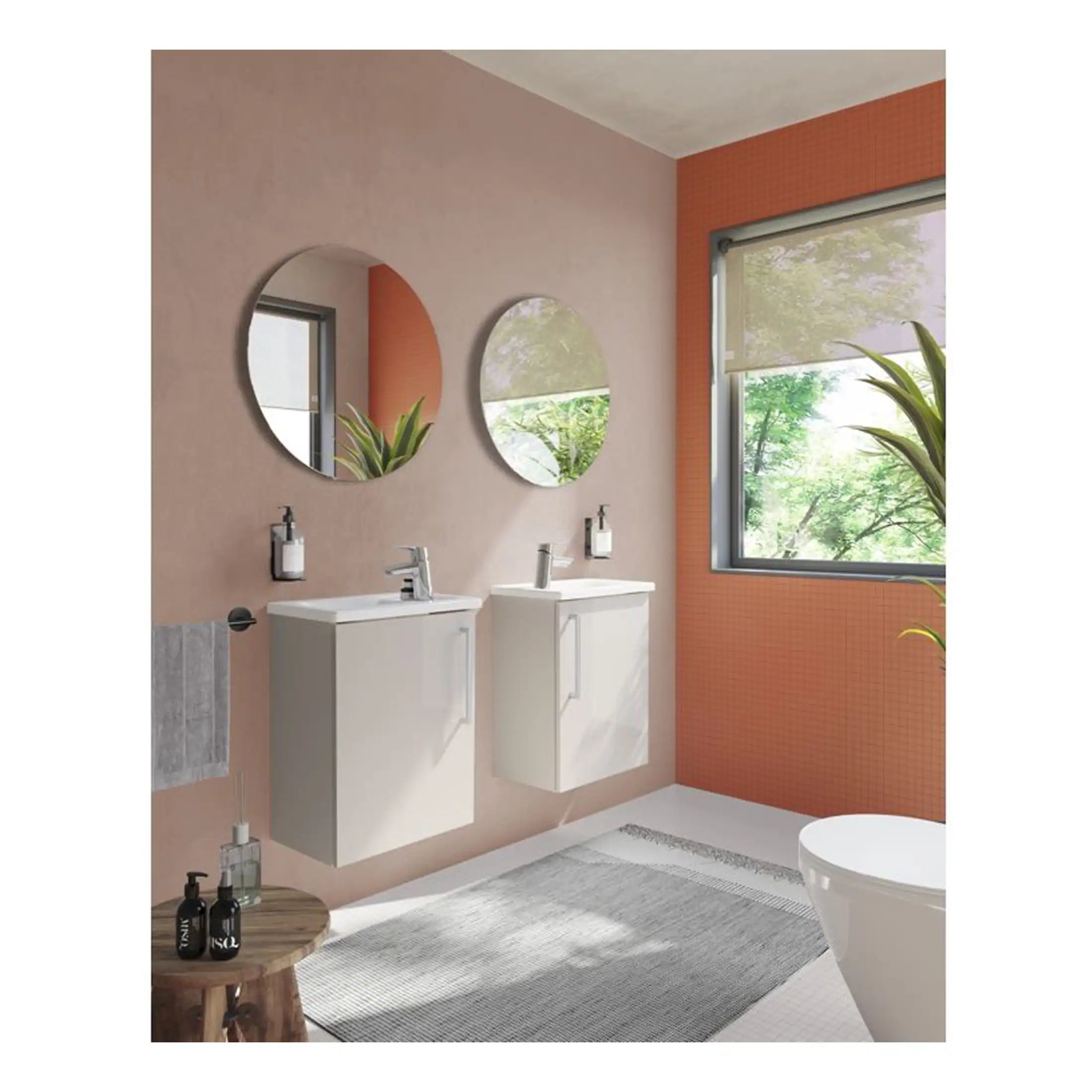 Modern bathroom with dual white vanities, round mirrors, and large window showcasing greenery, creating a bright, stylish space ideal for contemporary bathroom design and renovation.