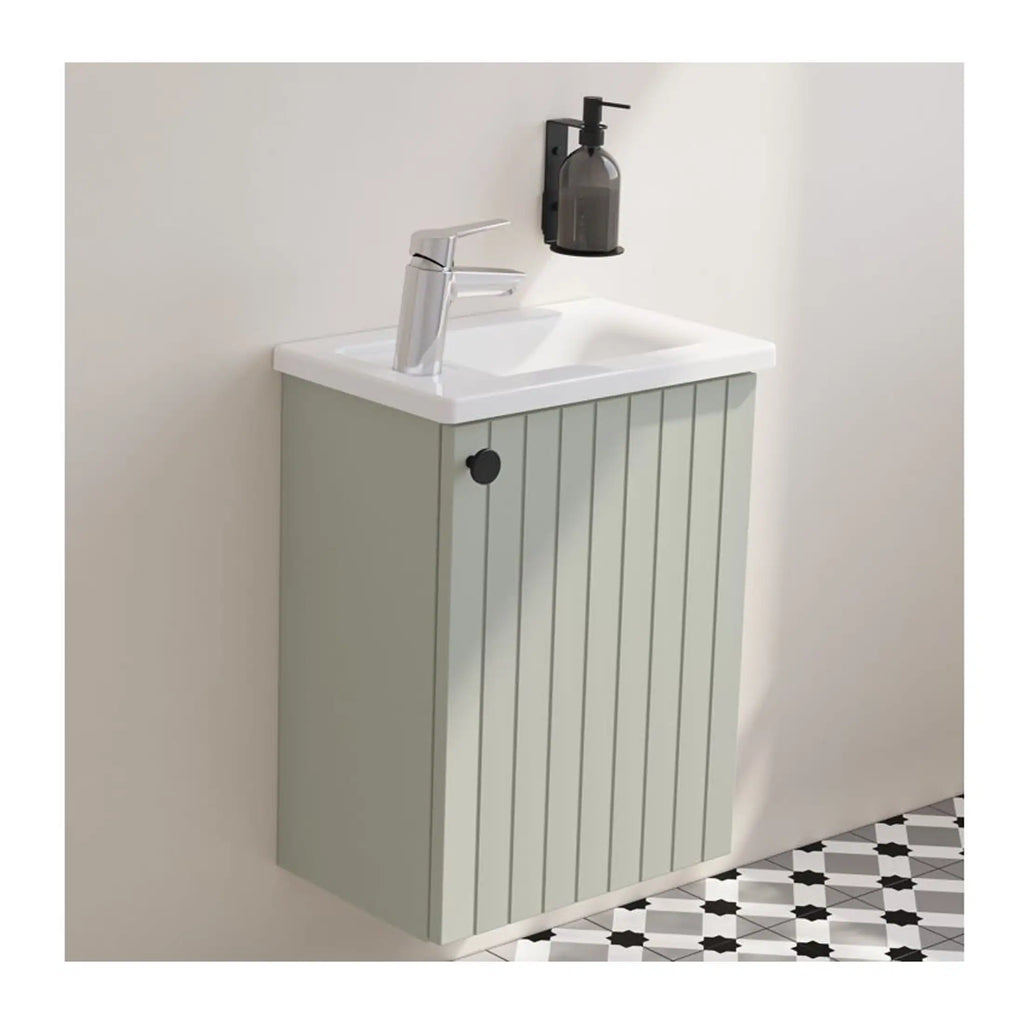 Modern bathroom sink unit with a sleek chrome tap, wall-mounted soap dispenser, and minimalist design, perfect for contemporary bathroom styling and space-saving bathroom storage solutions.