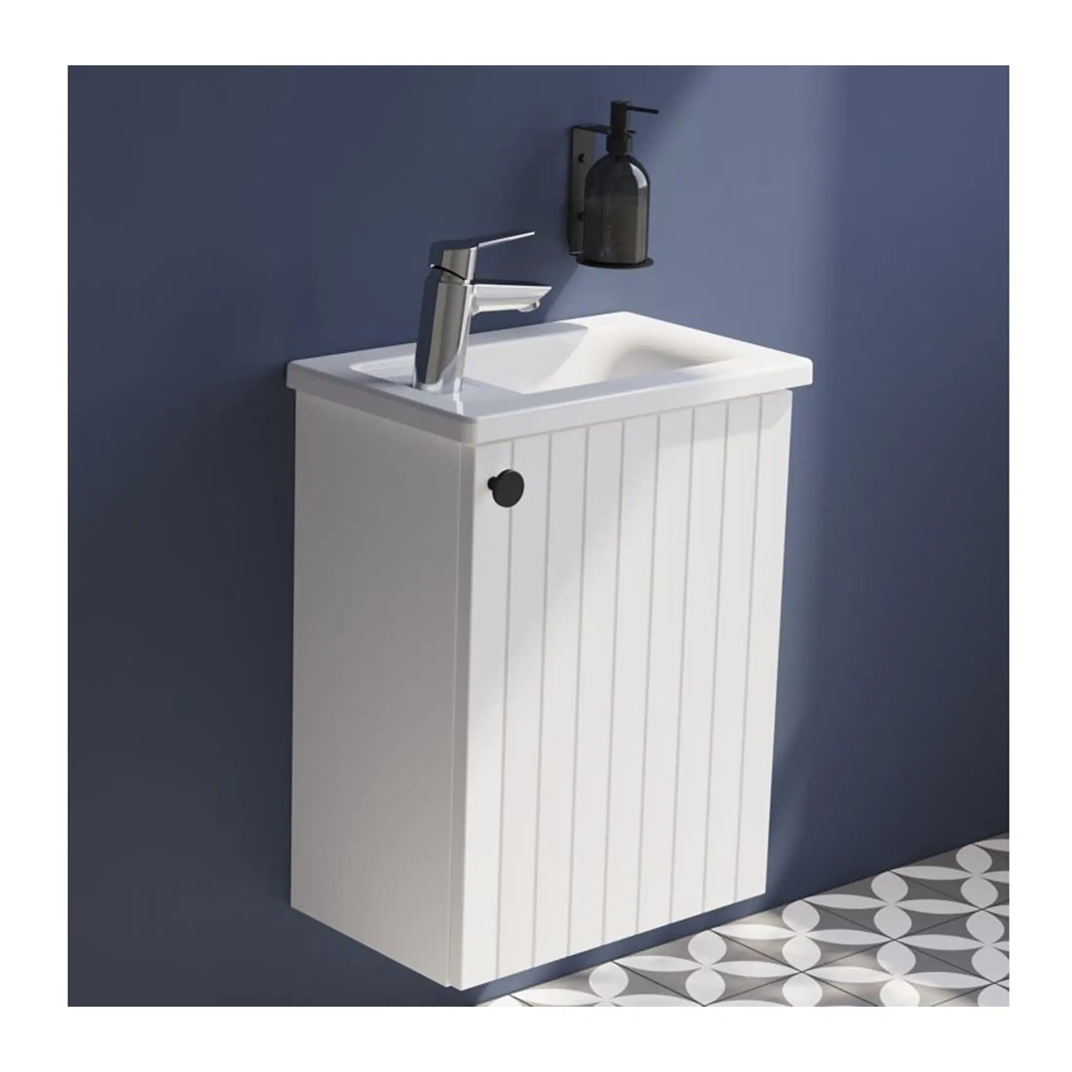 White bathroom vanity unit with integrated basin and chrome faucet, mounted on a dark blue wall in modern bathroom decor. Featuring functional storage and stylish design for contemporary bathrooms.