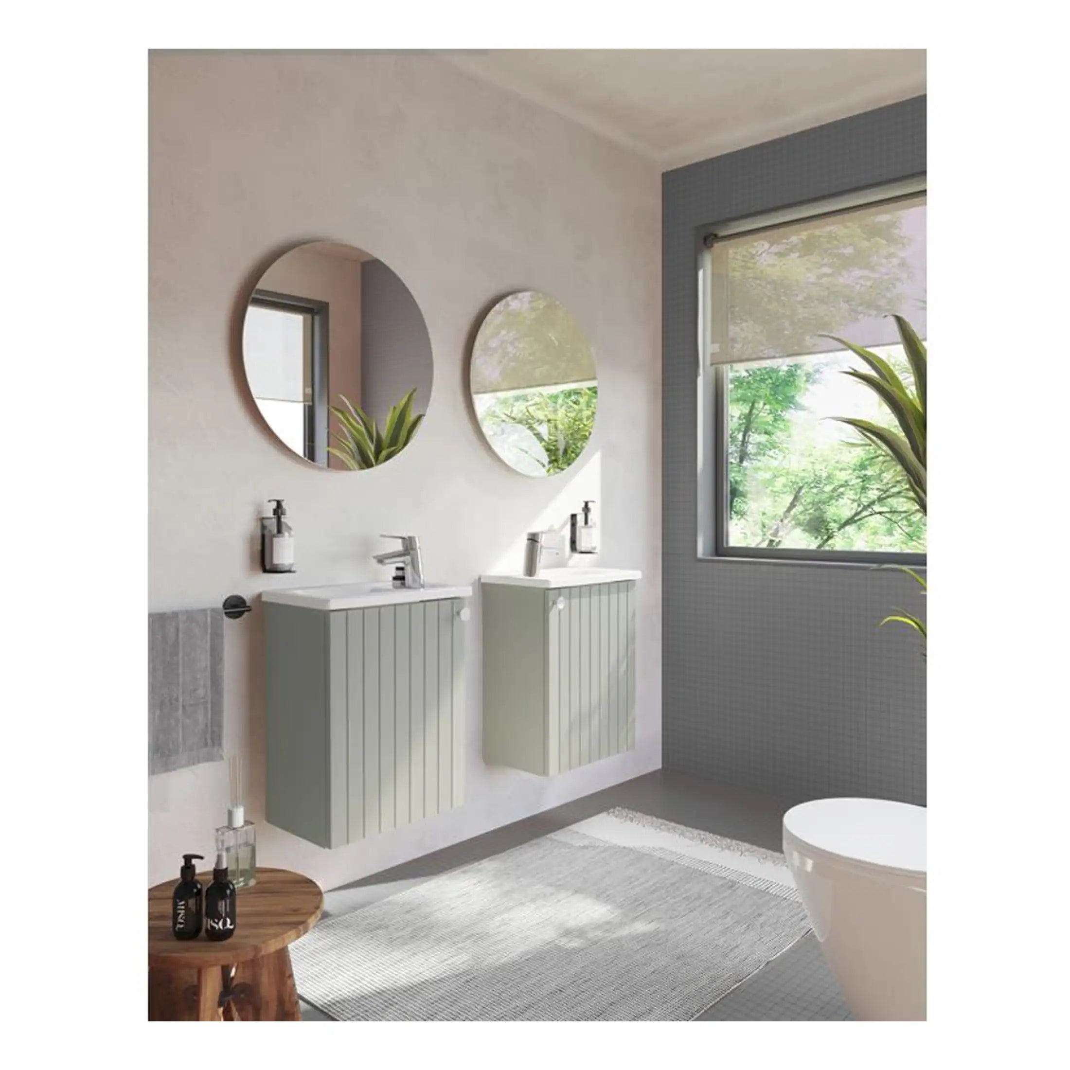 Sleek contemporary bathroom featuring twin wall-mounted vanities with round mirrors and modern chrome faucets, brightened by large window views of lush greenery, perfect for stylish and functional bathroom design.