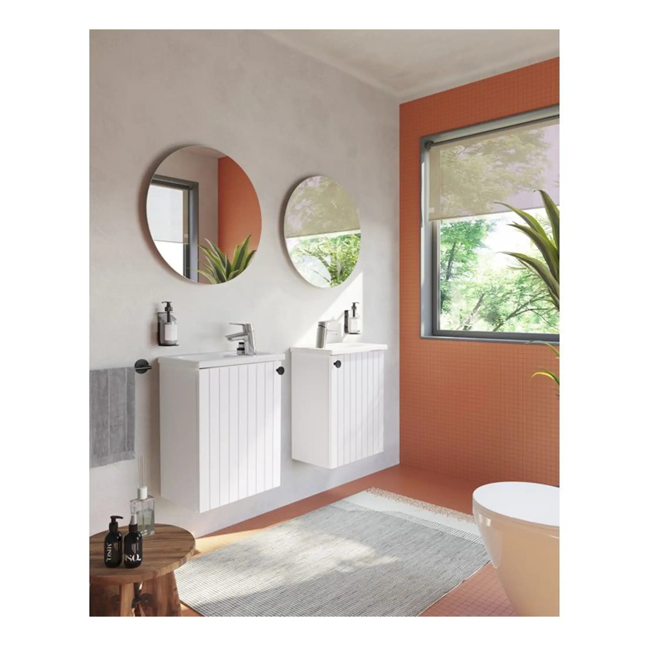 Modern bathroom with twin white vanities, round mirrors, and large window showcasing natural light and green outdoor scenery, perfect for contemporary home bathroom design.