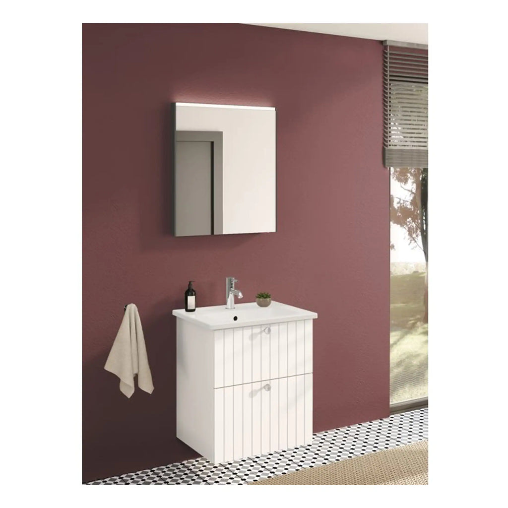 Modern white bathroom vanity with storage cabinet, matching mirror cabinet, set against a matte mauve accent wall with black and white patterned floor tiles, perfect for stylish Bubly bathrooms.