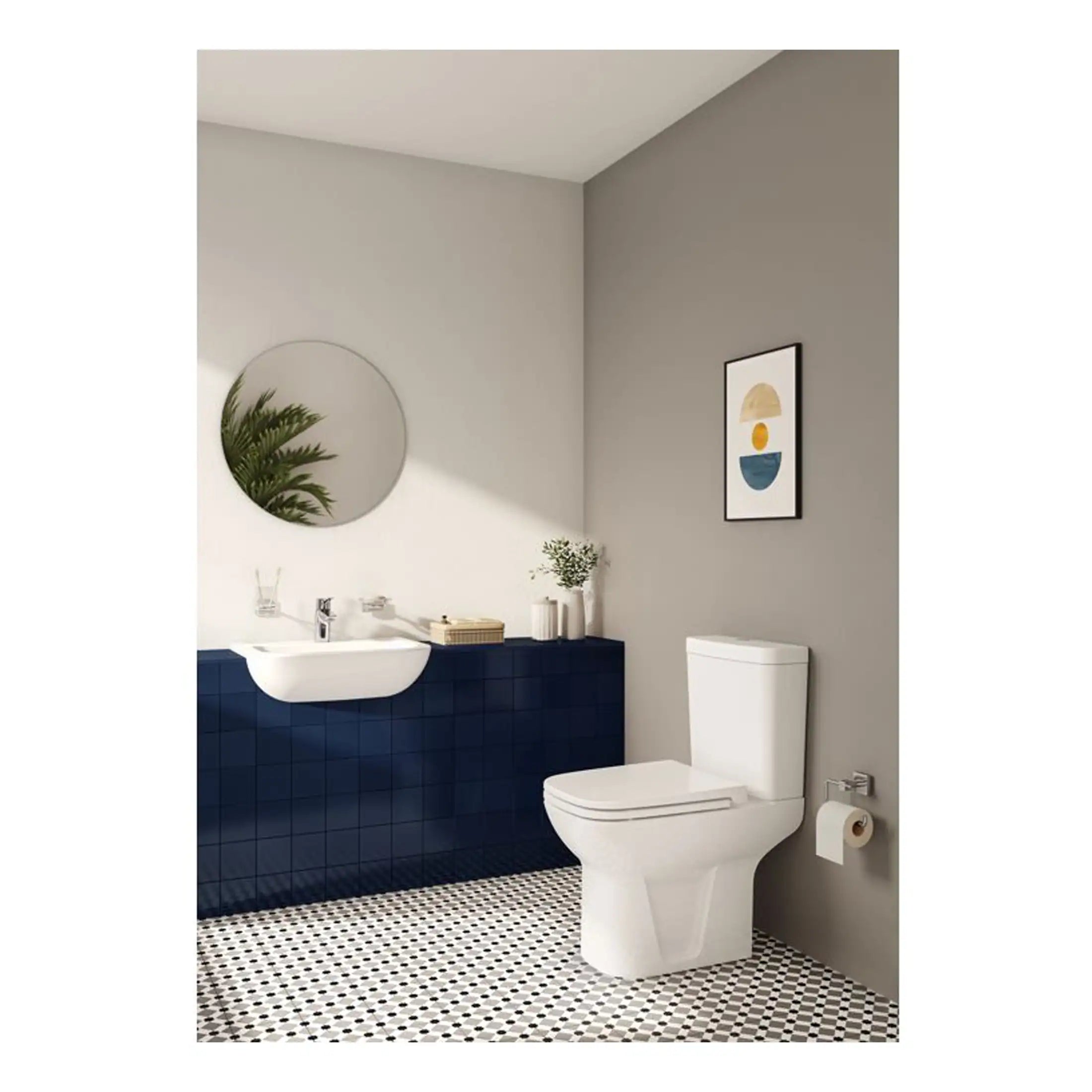 Modern bathroom with sleek white toilet and stylish vanity unit featuring navy blue tiles, a round mirror, and contemporary decor accents. Perfect for bathroom renovation or interior design ideas.