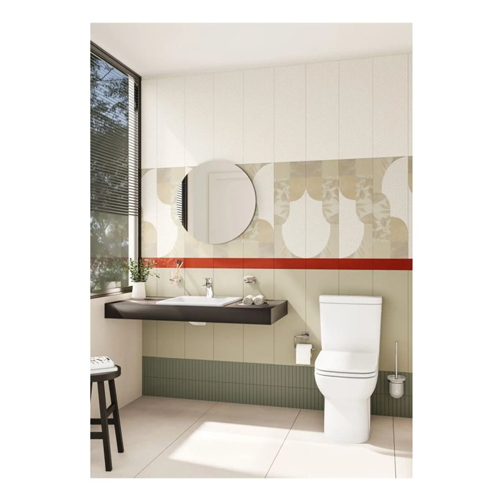Bathroom interior featuring modern fixtures, a sleek white toilet, black vanity with a round mirror, decorative wall tiles, and natural light from large window, showcasing contemporary bathroom design.