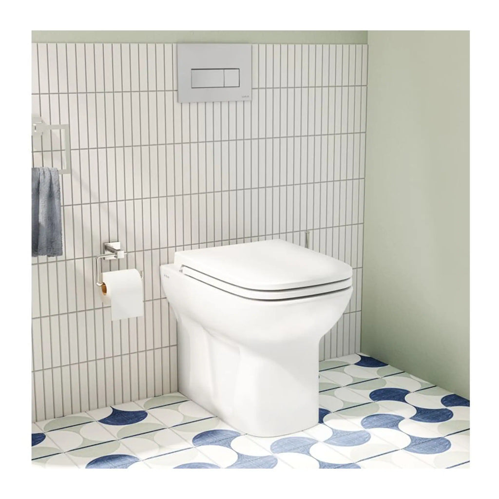 Sleek modern white toilet with bidet seat in minimalist bathroom setting with tiled walls and patterned floor, showcasing stylish and functional bathroom design.