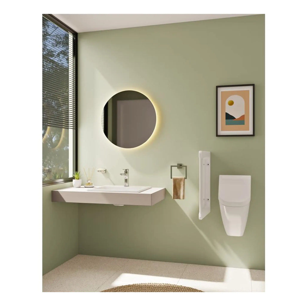 Sleek modern bathroom with wall-mounted sink, illuminated round mirror, smart toilet, minimalist decor, and large window offering natural light and green views, perfect for contemporary bathroom design.