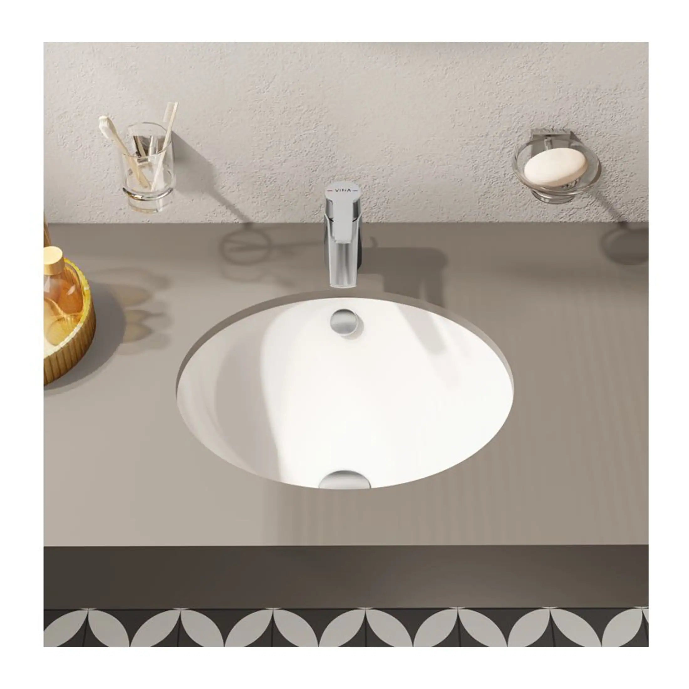 Sleek white bathroom sink with modern chrome faucet, surrounded by bathroom essentials, on a grey countertop in a contemporary bathroom setting.