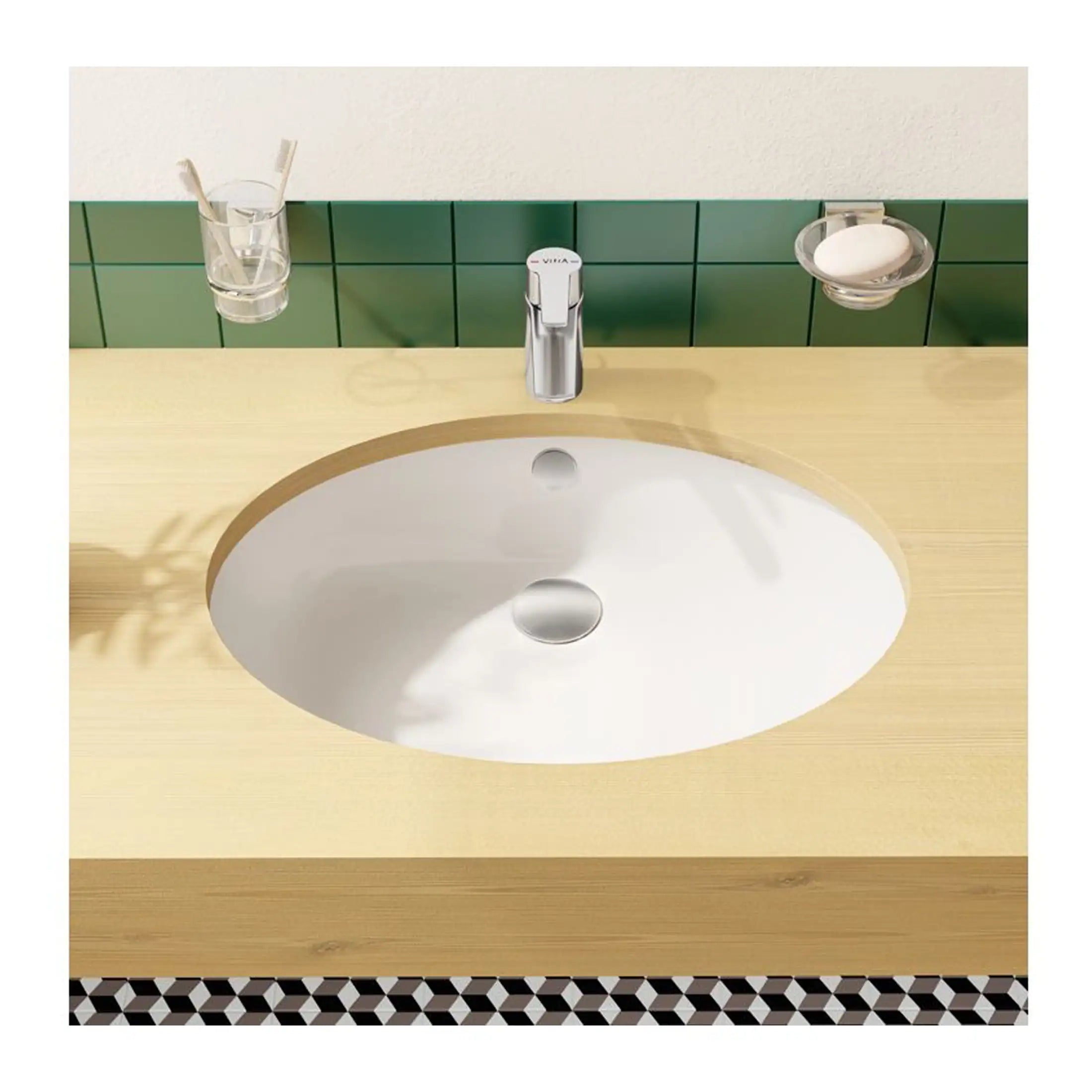 Sleek modern bathroom sink with wooden countertop and green tiled backsplash, featuring a chrome faucet and minimalist accessories for stylish bathroom design.