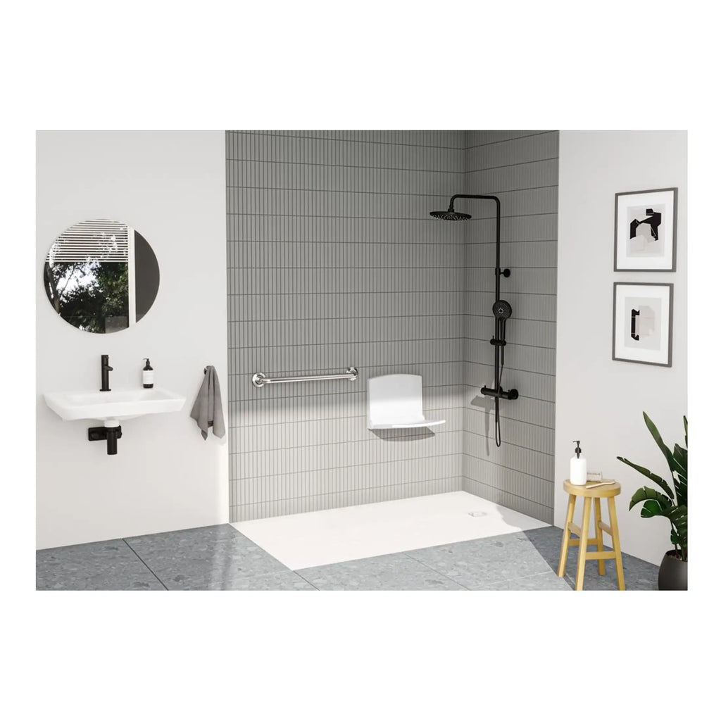 Modern accessible shower room with black fixtures, wall-mounted sink, and minimalist decor in a contemporary bathroom design.