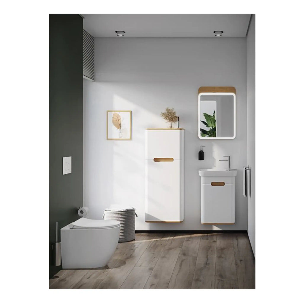 Contemporary bathroom with modern white bathroom furniture, wall-mounted mirror, and eco-friendly decor, featuring sleek design and efficient storage solutions for a stylish bathroom upgrade.