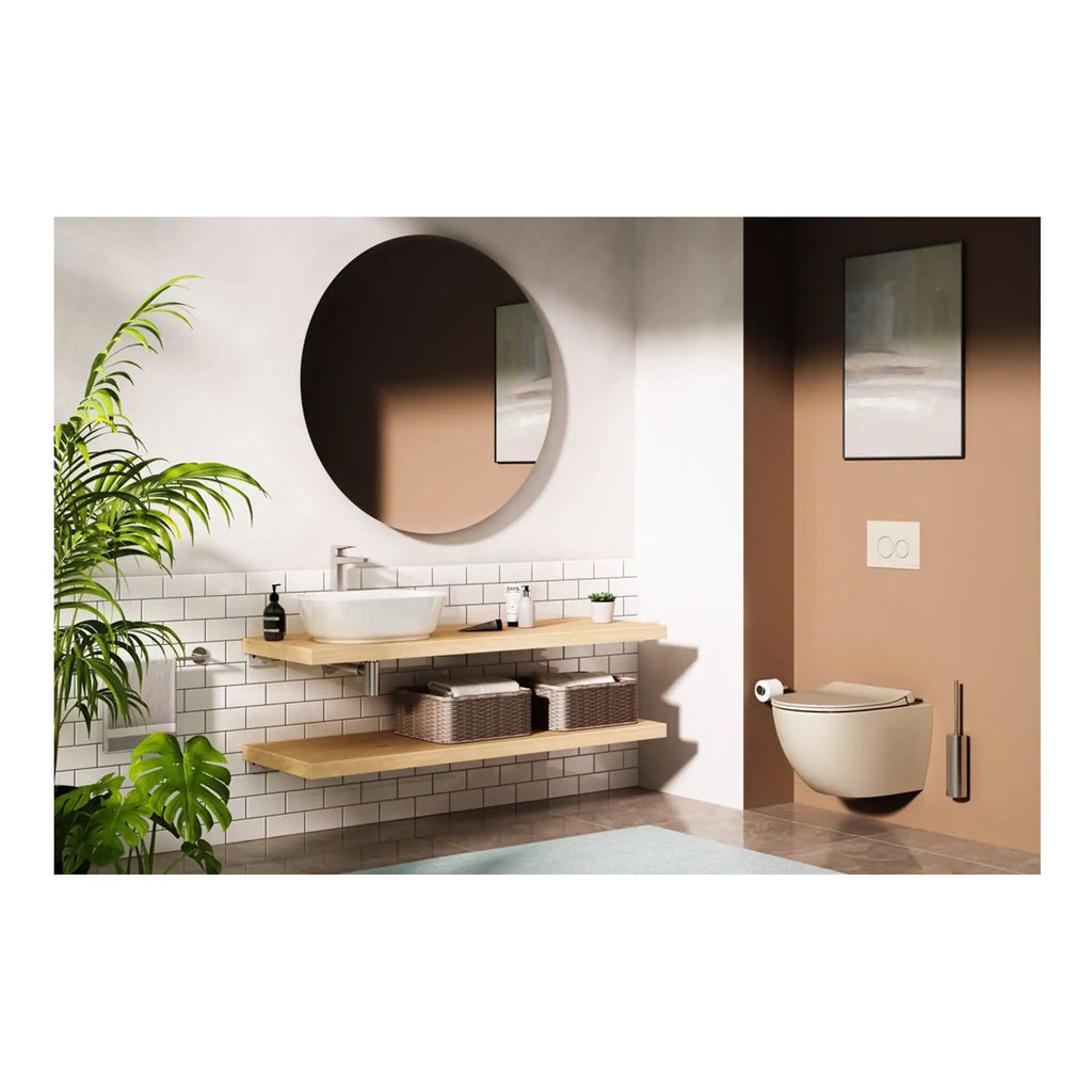 Sleek modern bathroom featuring a wall-mounted toilet, contemporary sink, large round mirror, and minimalist decor with natural wood accents and lush green plants, perfect for stylish bathroom renovation.