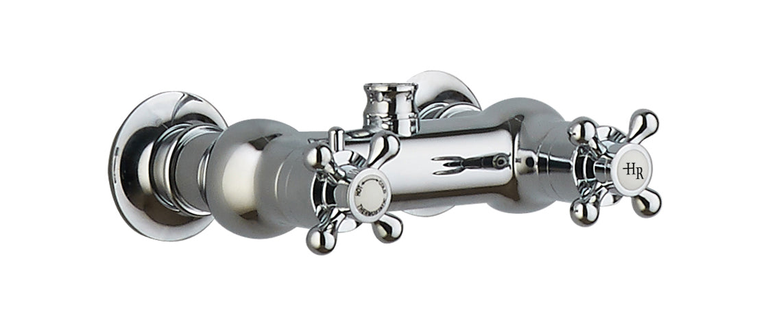 Chrome bathroom tap with vintage-style cross handles, polished finish, ideal for traditional bathroom upgrades, high-quality fixtures for elegant bathroom design.