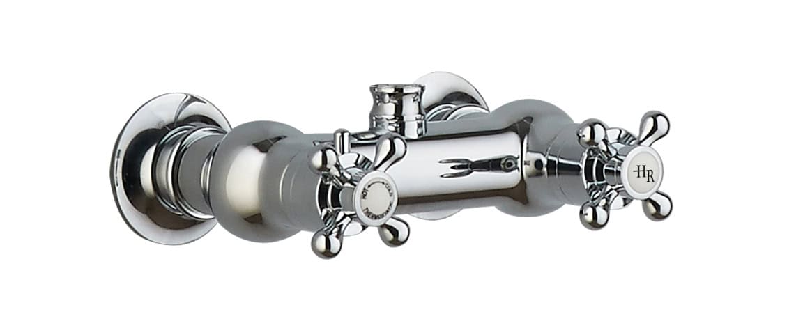Brass bathroom tap with cross handles and chrome finish for vintage-style bathroom plumbing and fixtures.